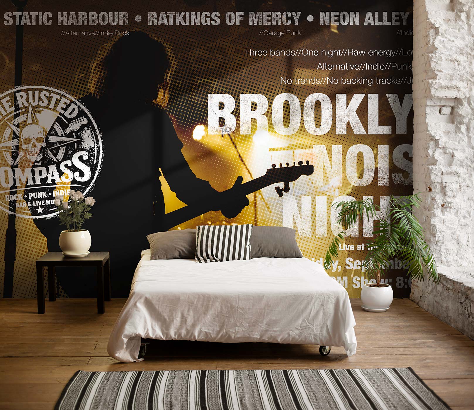 Schlafzimmer mit weißem Bett, schwarz-weiß gestreiftem Kissen, Pflanzen und Wandgestaltung mit einer Tapete eines Gitarristen und Texten zu Musikbands von Superwalls.